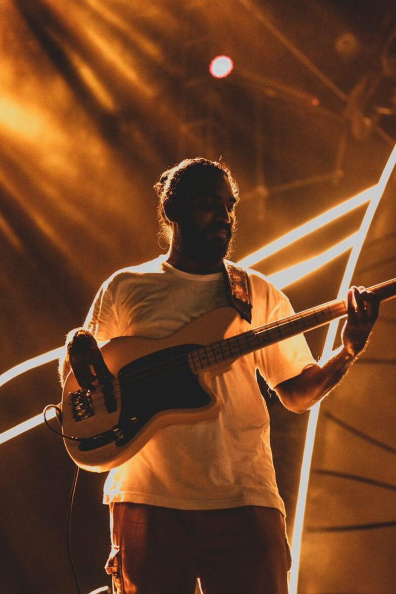 On stage under amber beams